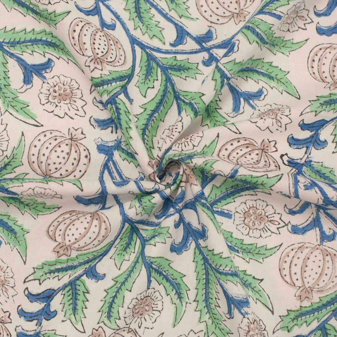 White botanical printed cotton fabric with blue green vines and vegetable blooms