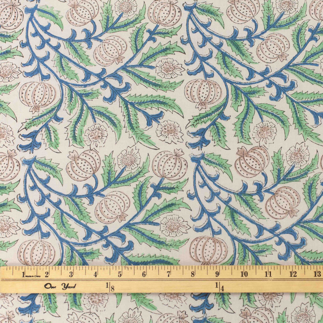 White botanical printed cotton fabric with blue green vines and vegetable blooms