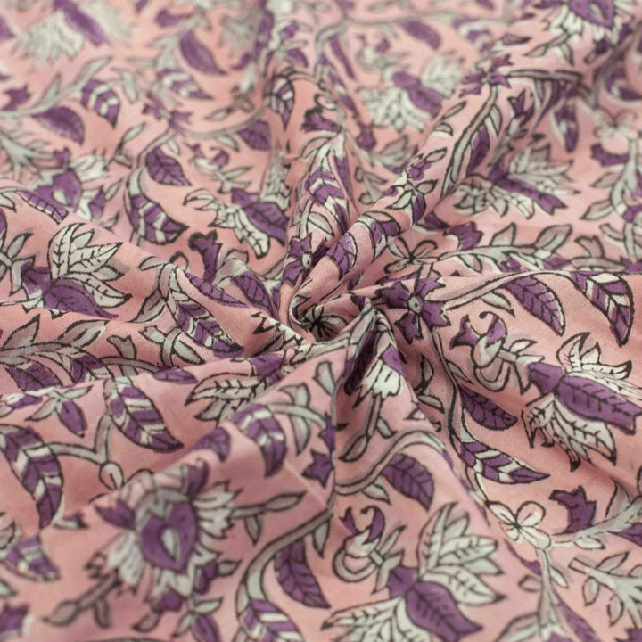 Hand-printed Forestine cotton fabric - soft pink background with brown-purple motifs