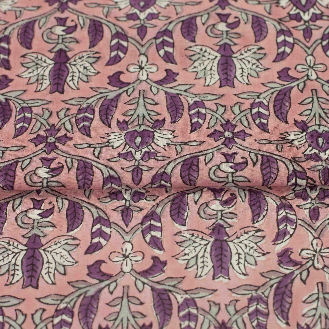 Hand-printed Forestine cotton fabric - soft pink background with brown-purple motifs