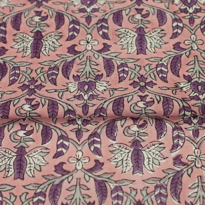 Hand-printed Forestine cotton fabric - soft pink background with brown-purple motifs