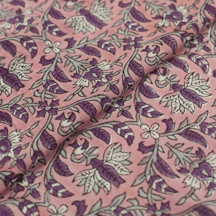 Hand-printed Forestine cotton fabric - soft pink background with brown-purple motifs