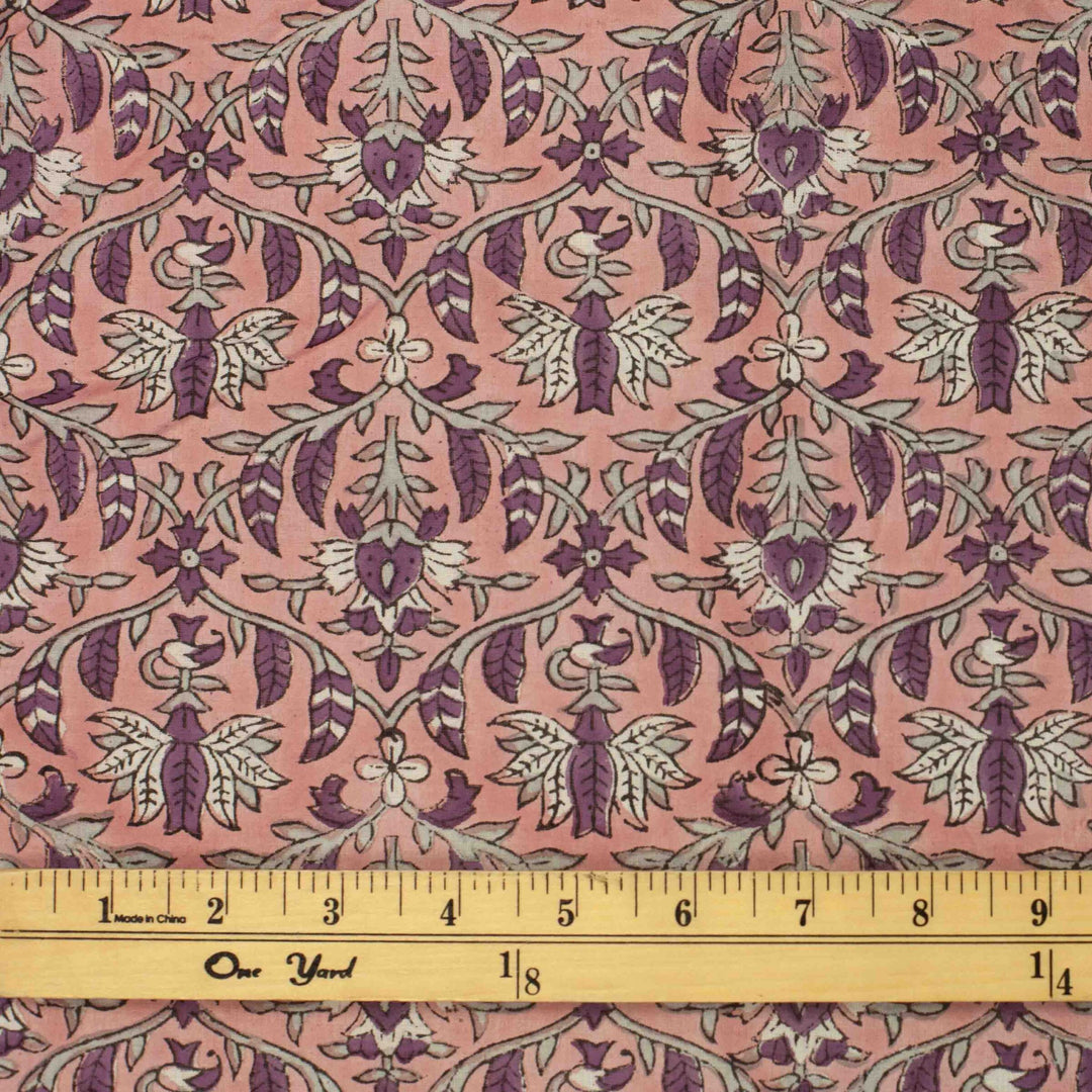 Hand-printed Forestine cotton fabric - soft pink background with brown-purple motifs
