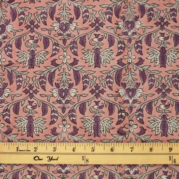 Hand-printed Forestine cotton fabric - soft pink background with brown-purple motifs
