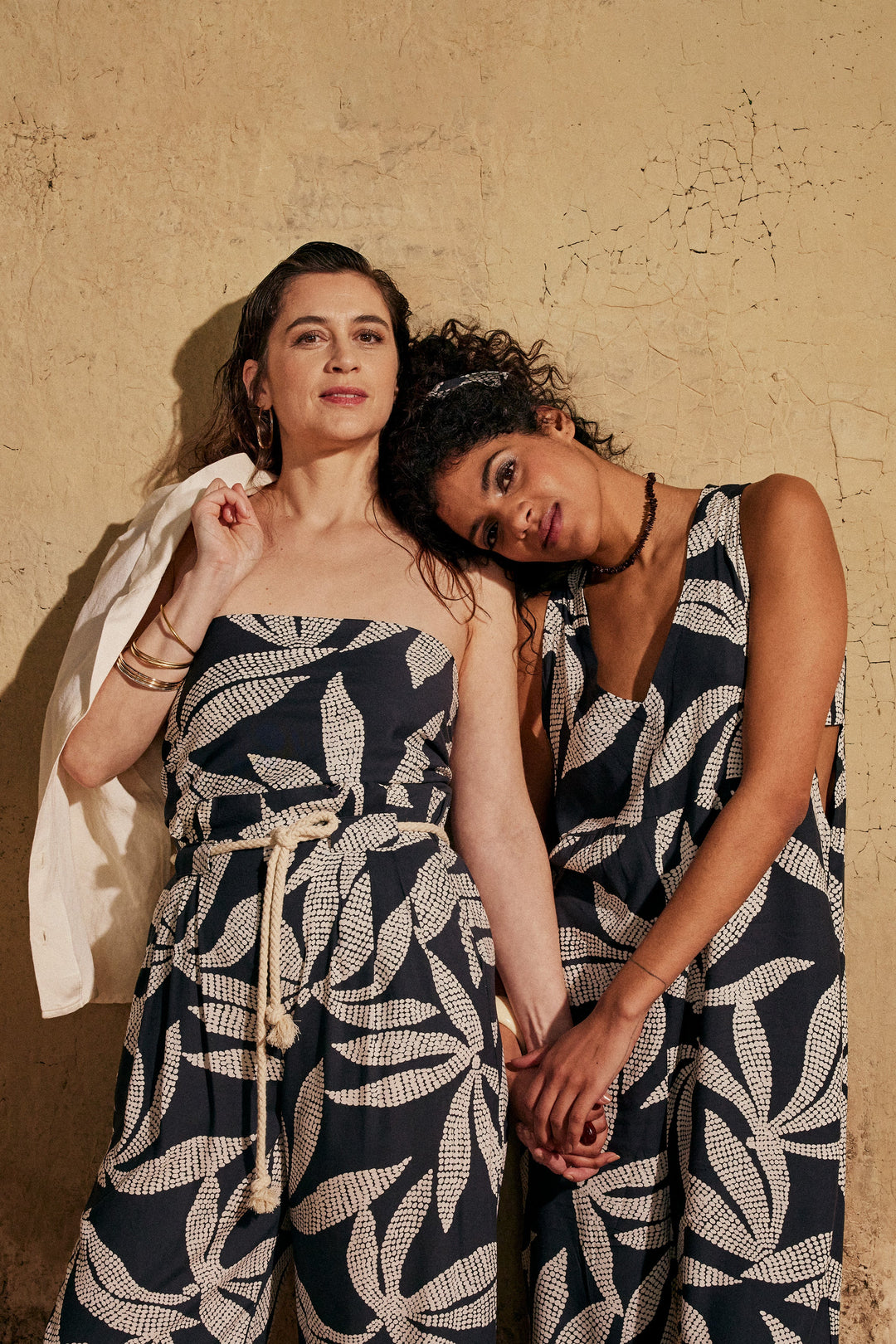 Viscose Challis fabric in deep charcoal with white leaf print, lightweight 55-inch wide textile for dresses, skirts, and blouses