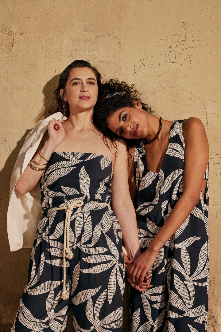 Viscose Challis fabric in deep charcoal with white leaf print, lightweight 55-inch wide textile for dresses, skirts, and blouses