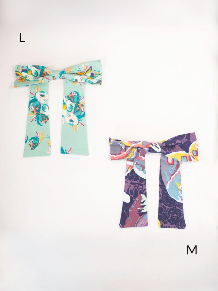 Handmade colorful classic hair bow on a barrette clip, perfect for all ages and occasions.
