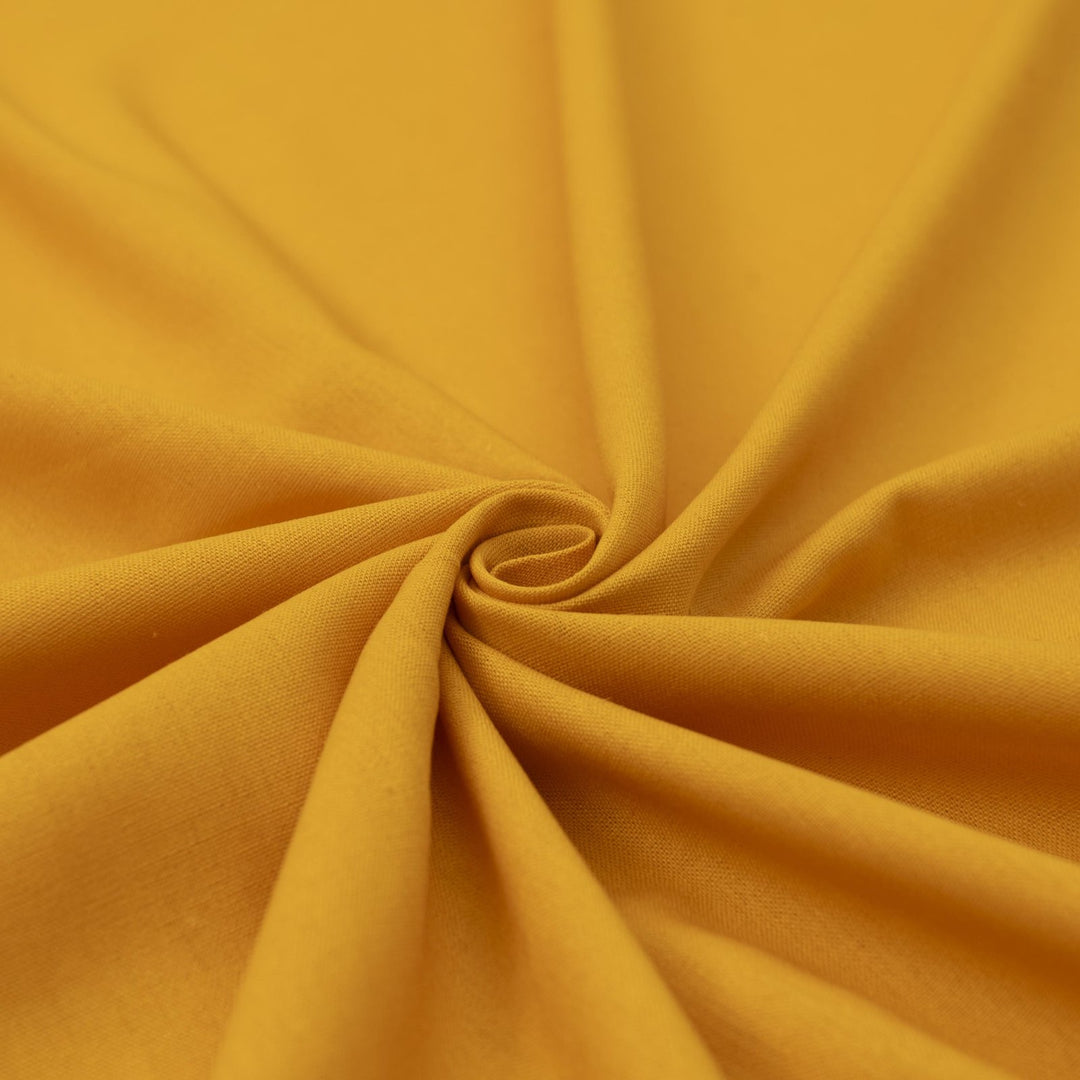 Laundered linen fabric in marigold – 100% linen, 6 oz medium weight, pre-washed, 58 inches wide, soft drape for dresses and tops