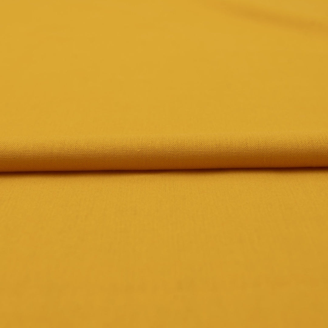 Laundered linen fabric in marigold – 100% linen, 6 oz medium weight, pre-washed, 58 inches wide, soft drape for dresses and tops