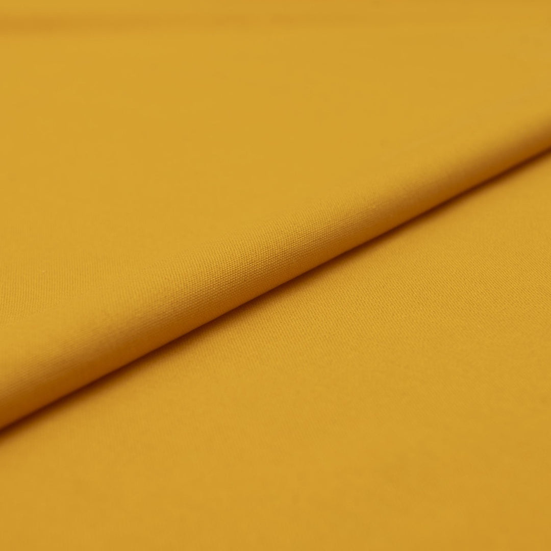 Laundered linen fabric in marigold – 100% linen, 6 oz medium weight, pre-washed, 58 inches wide, soft drape for dresses and tops
