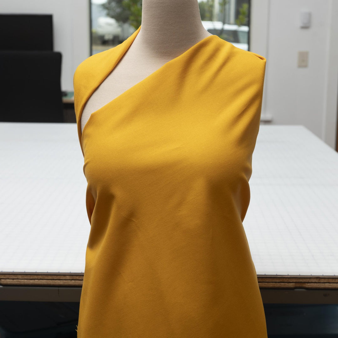 Laundered linen fabric in marigold – 100% linen, 6 oz medium weight, pre-washed, 58 inches wide, soft drape for dresses and tops