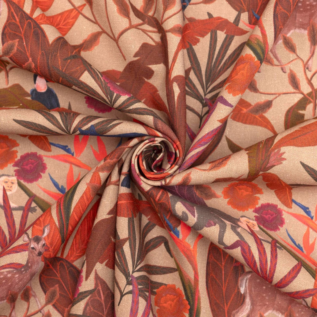 Italian linen fabric in brown with jungle print – features monkeys, birds, and deer on soft yet crisp lightweight linen, ideal for shirts, dresses, and skirts
