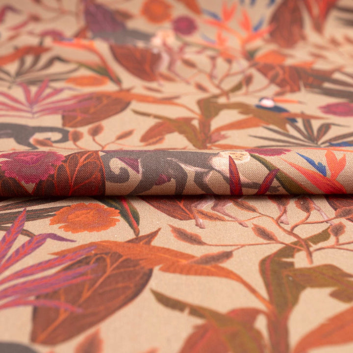 Italian linen fabric in brown with jungle print – features monkeys, birds, and deer on soft yet crisp lightweight linen, ideal for shirts, dresses, and skirts