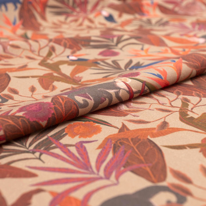 Italian linen fabric in brown with jungle print – features monkeys, birds, and deer on soft yet crisp lightweight linen, ideal for shirts, dresses, and skirts