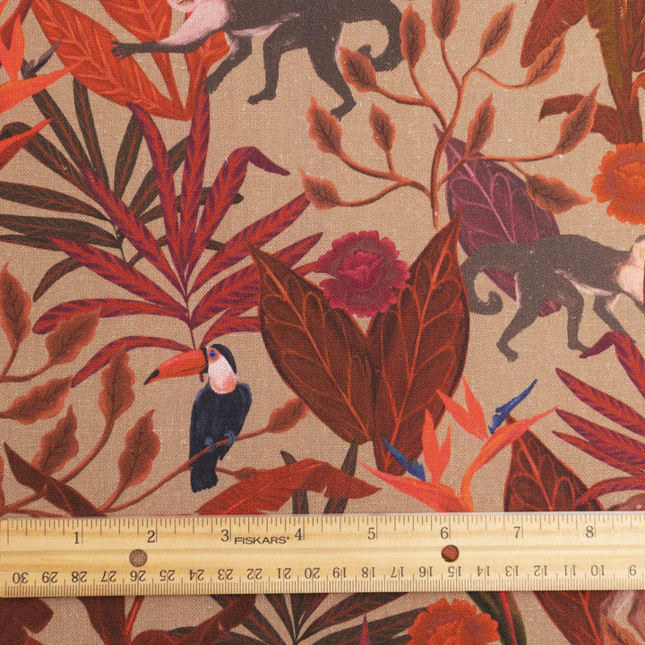 Italian linen fabric in brown with jungle print – features monkeys, birds, and deer on soft yet crisp lightweight linen, ideal for shirts, dresses, and skirts