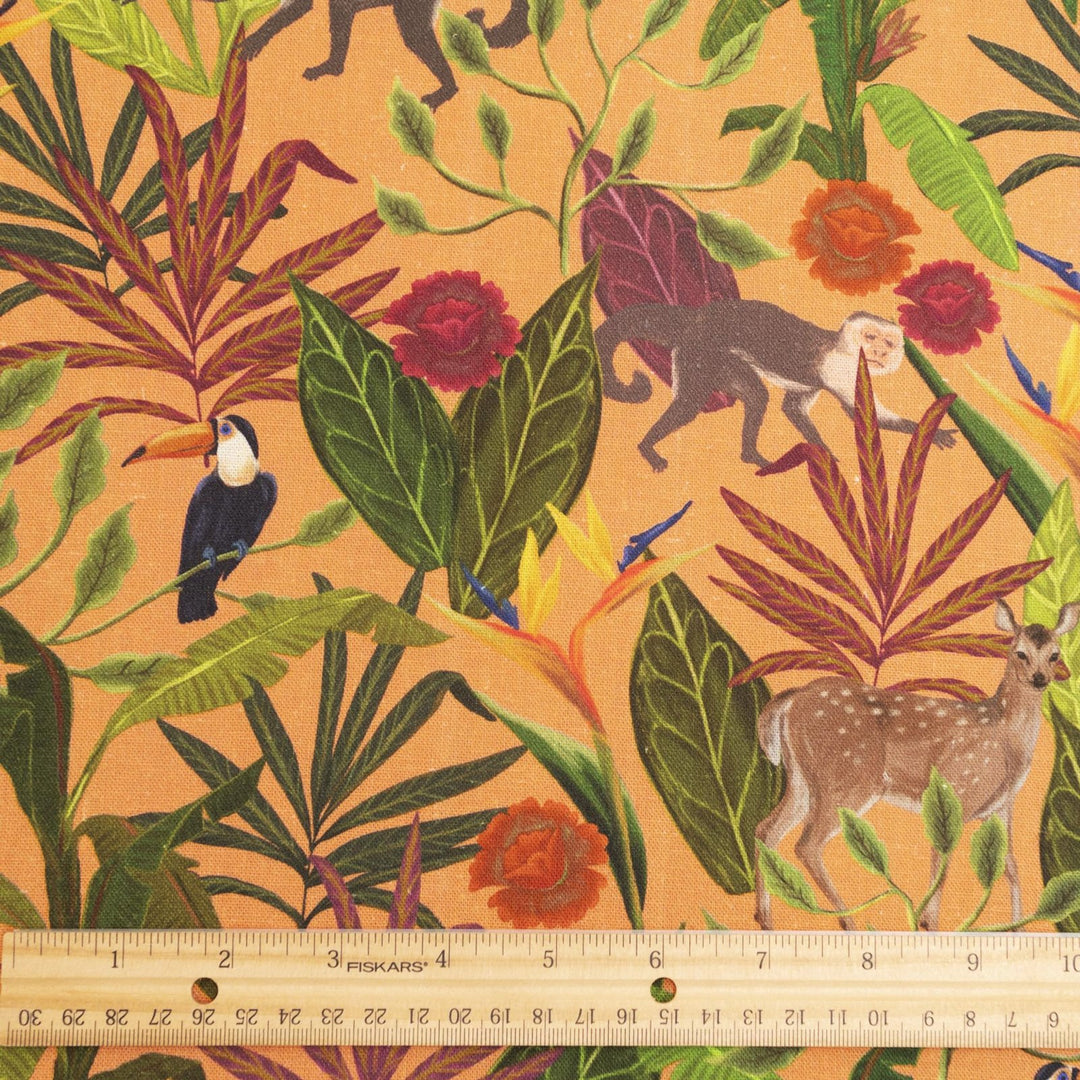 "Italian linen fabric in vibrant orange with jungle print – features monkeys, birds, and deer on lightweight linen, perfect for shirts, dresses, and skirts"


