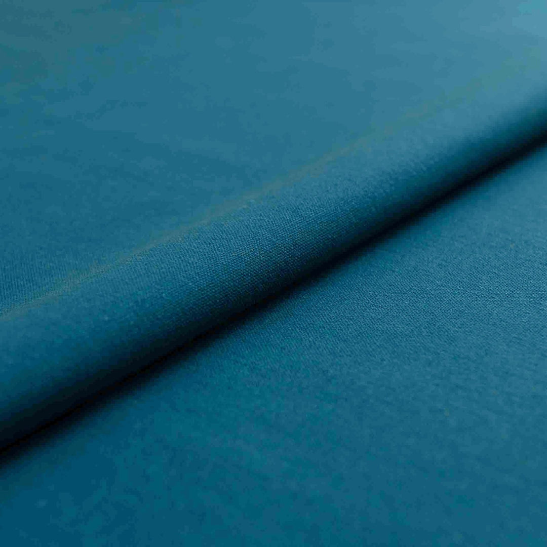 Teal laundered linen fabric, pre-washed for softness and elegant drape

