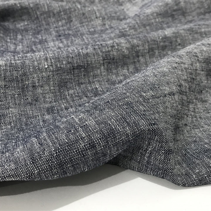 Linen rayon yarn dyed fabric in denim blue with lightweight texture and soft drape, ideal for sewing dresses, tops, and breathable garments.


