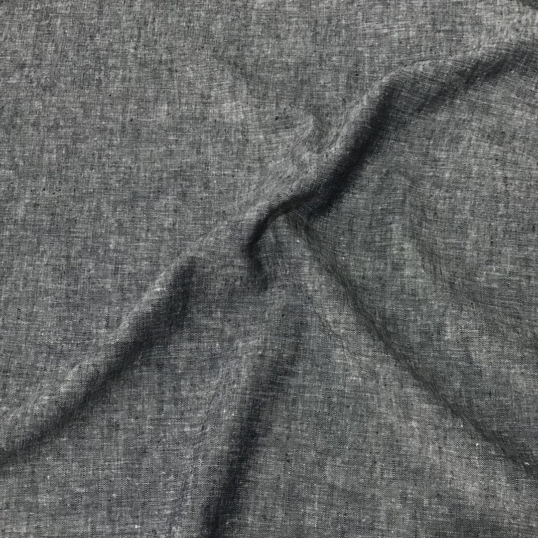 Linen rayon yarn dyed fabric in denim blue with lightweight texture and soft drape, ideal for sewing dresses, tops, and breathable garments.

