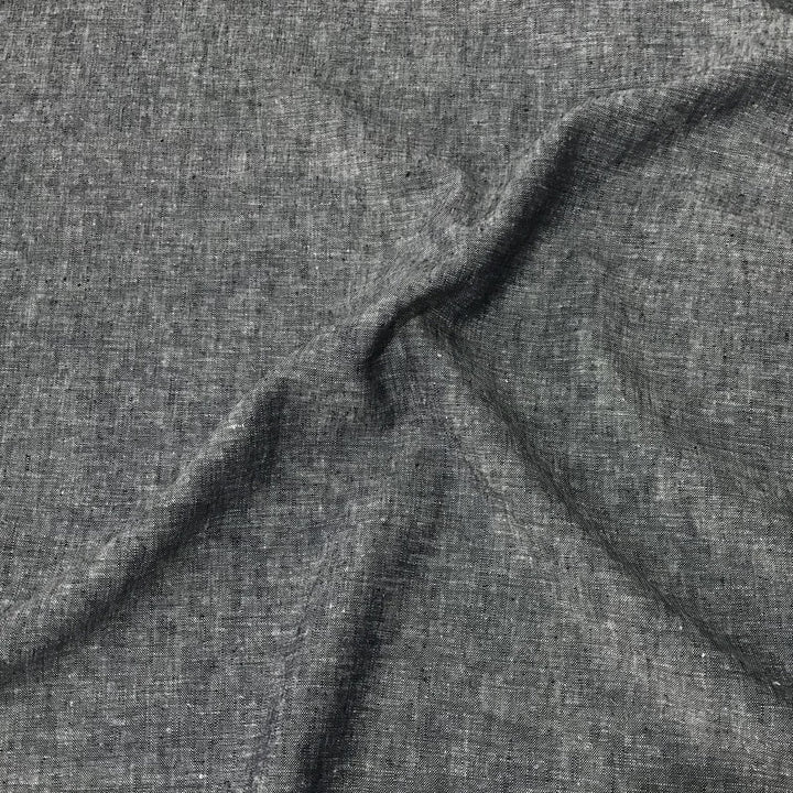 Linen rayon yarn dyed fabric in denim blue with lightweight texture and soft drape, ideal for sewing dresses, tops, and breathable garments.

