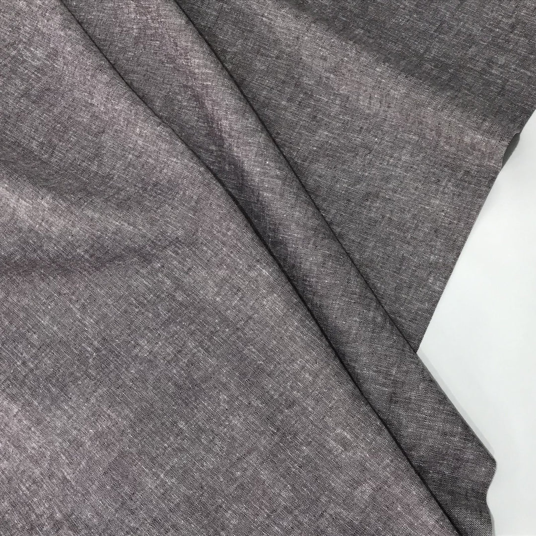 Linen rayon yarn dyed fabric in soft heliotrope purple, lightweight with subtle color texture and soft drape, ideal for dresses, tops, and skirts.

