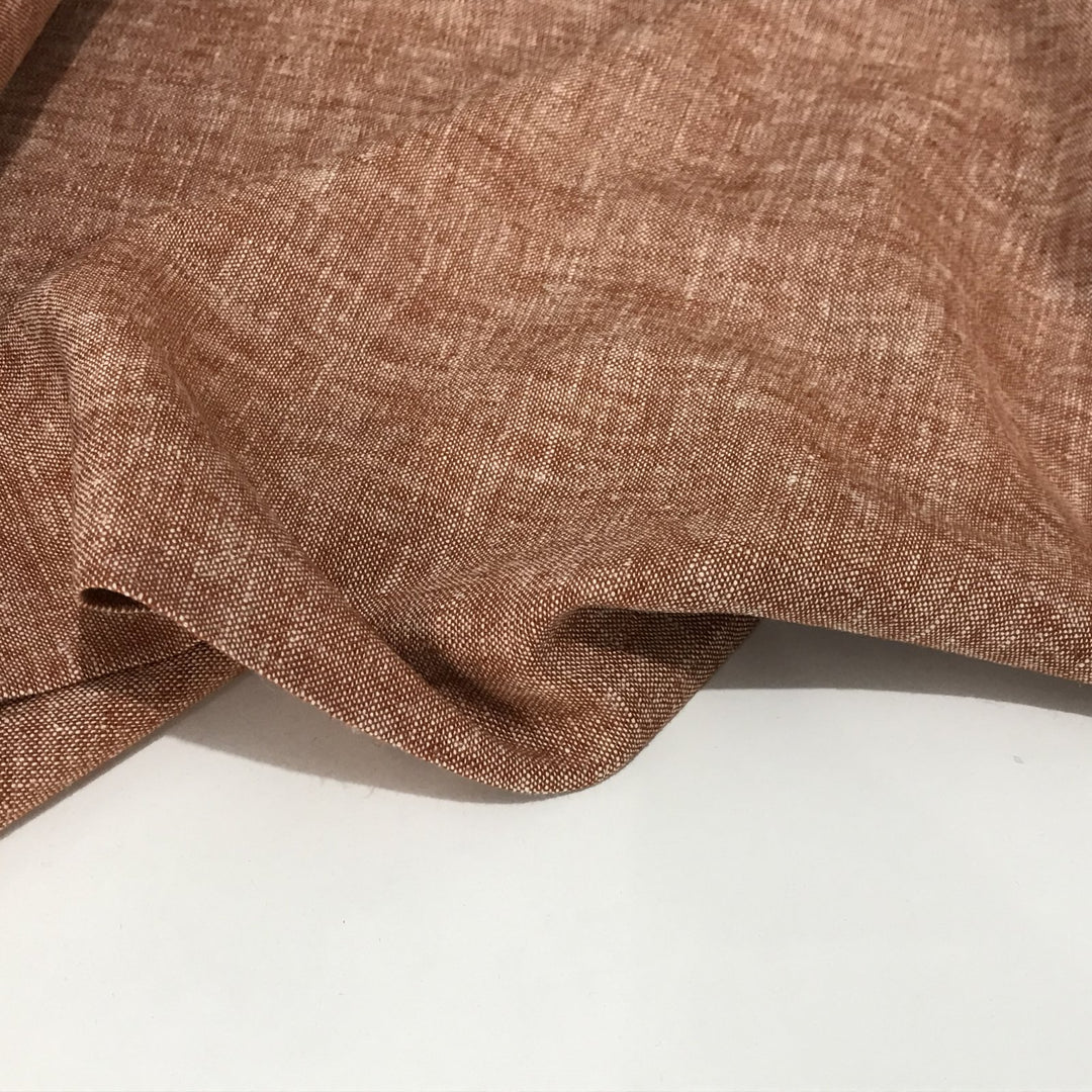 Linen rayon yarn dyed fabric in warm redrock color with soft drape and lightweight texture, perfect for handmade dresses, tops, and skirts.

