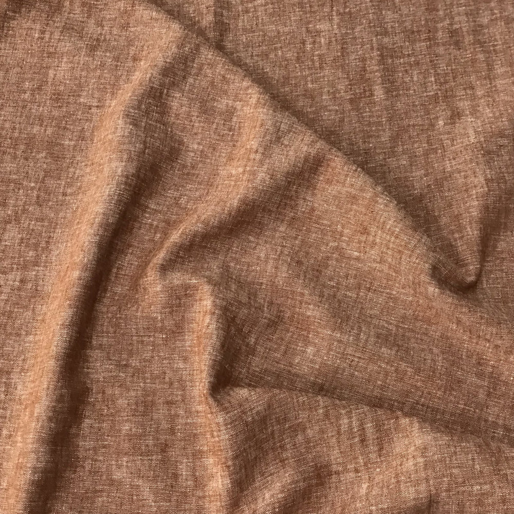 Linen rayon yarn dyed fabric in warm redrock color with soft drape and lightweight texture, perfect for handmade dresses, tops, and skirts.

