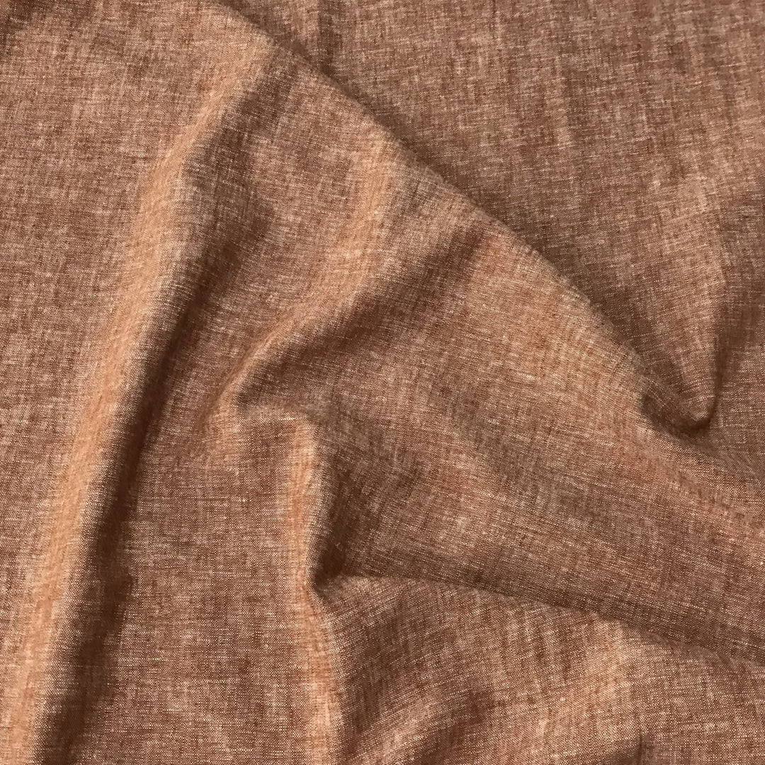 Linen rayon yarn dyed fabric in warm redrock color with soft drape and lightweight texture, perfect for handmade dresses, tops, and skirts.

