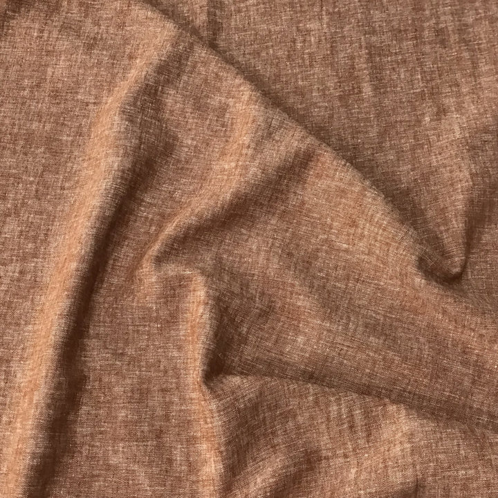 Linen rayon yarn dyed fabric in warm redrock color with soft drape and lightweight texture, perfect for handmade dresses, tops, and skirts.

