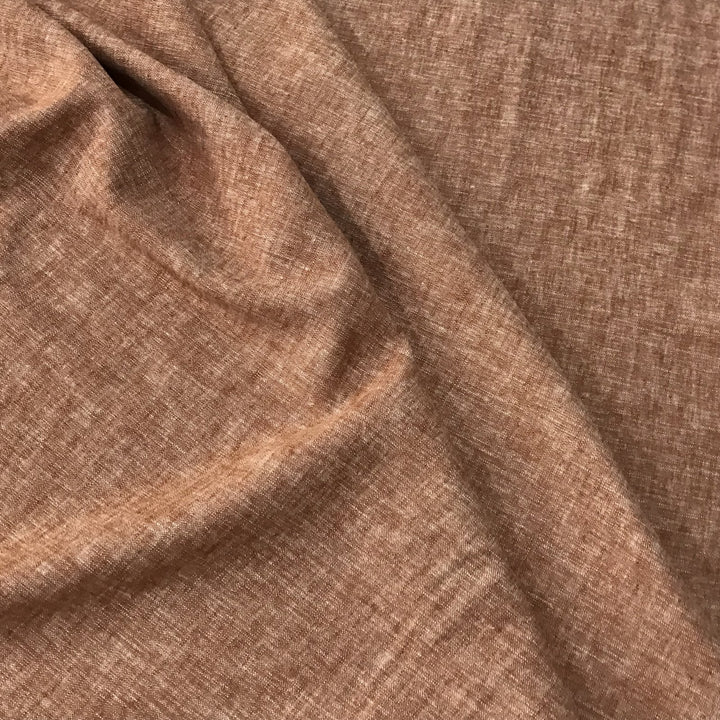 Linen rayon yarn dyed fabric in warm redrock color with soft drape and lightweight texture, perfect for handmade dresses, tops, and skirts.

