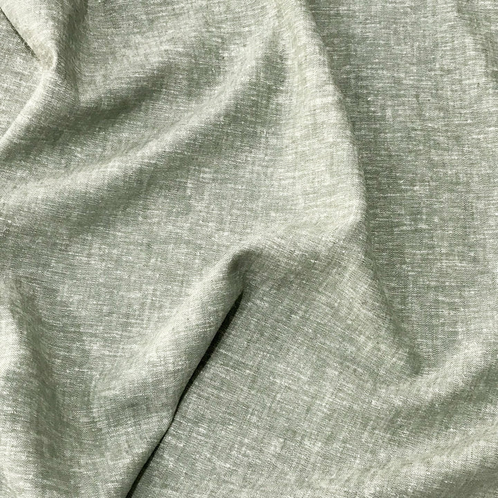 Linen rayon yarn dyed fabric in sage green with lightweight texture and soft drape, ideal for sewing tops, dresses, and layering garments.


