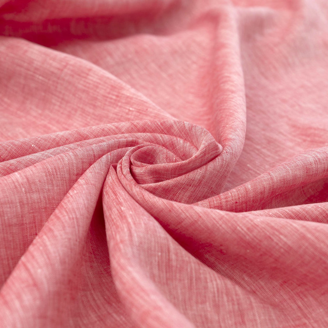Red linen chambray fabric, lightweight and breathable, with a soft texture ideal for sewing tops, dresses, tunics, and year-round garments.

