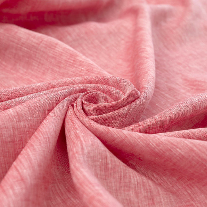 Red linen chambray fabric, lightweight and breathable, with a soft texture ideal for sewing tops, dresses, tunics, and year-round garments.

