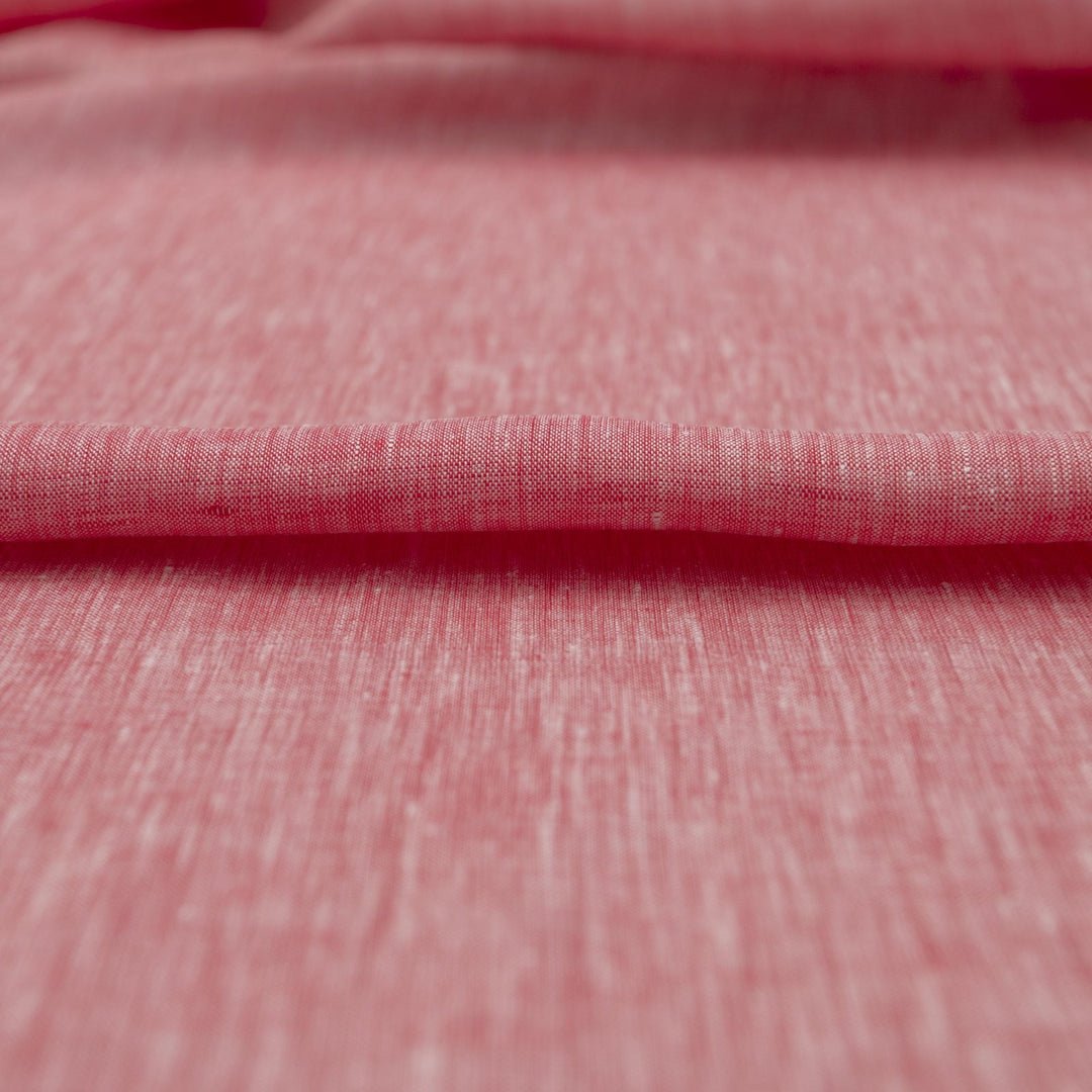 Red linen chambray fabric, lightweight and breathable, with a soft texture ideal for sewing tops, dresses, tunics, and year-round garments.

