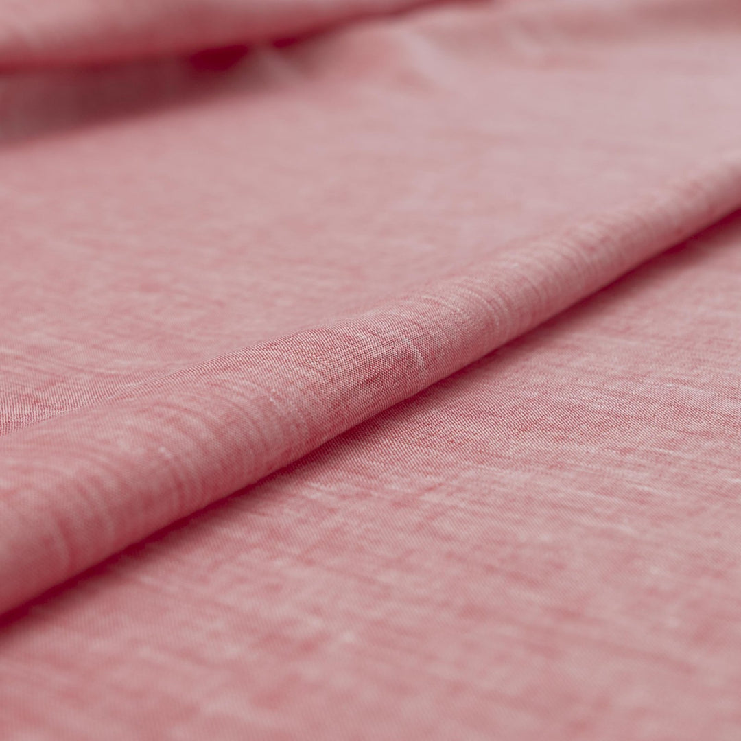Red linen chambray fabric, lightweight and breathable, with a soft texture ideal for sewing tops, dresses, tunics, and year-round garments.

