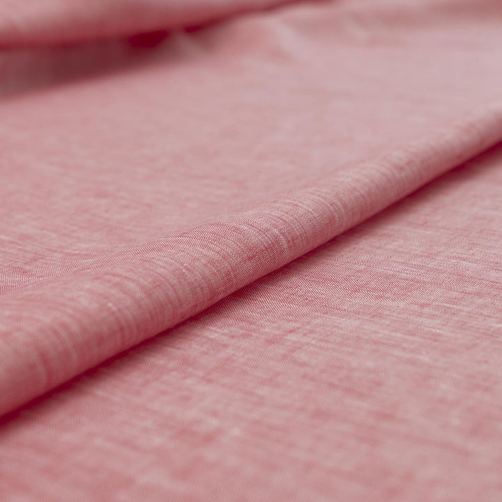 Red linen chambray fabric, lightweight and breathable, with a soft texture ideal for sewing tops, dresses, tunics, and year-round garments.

