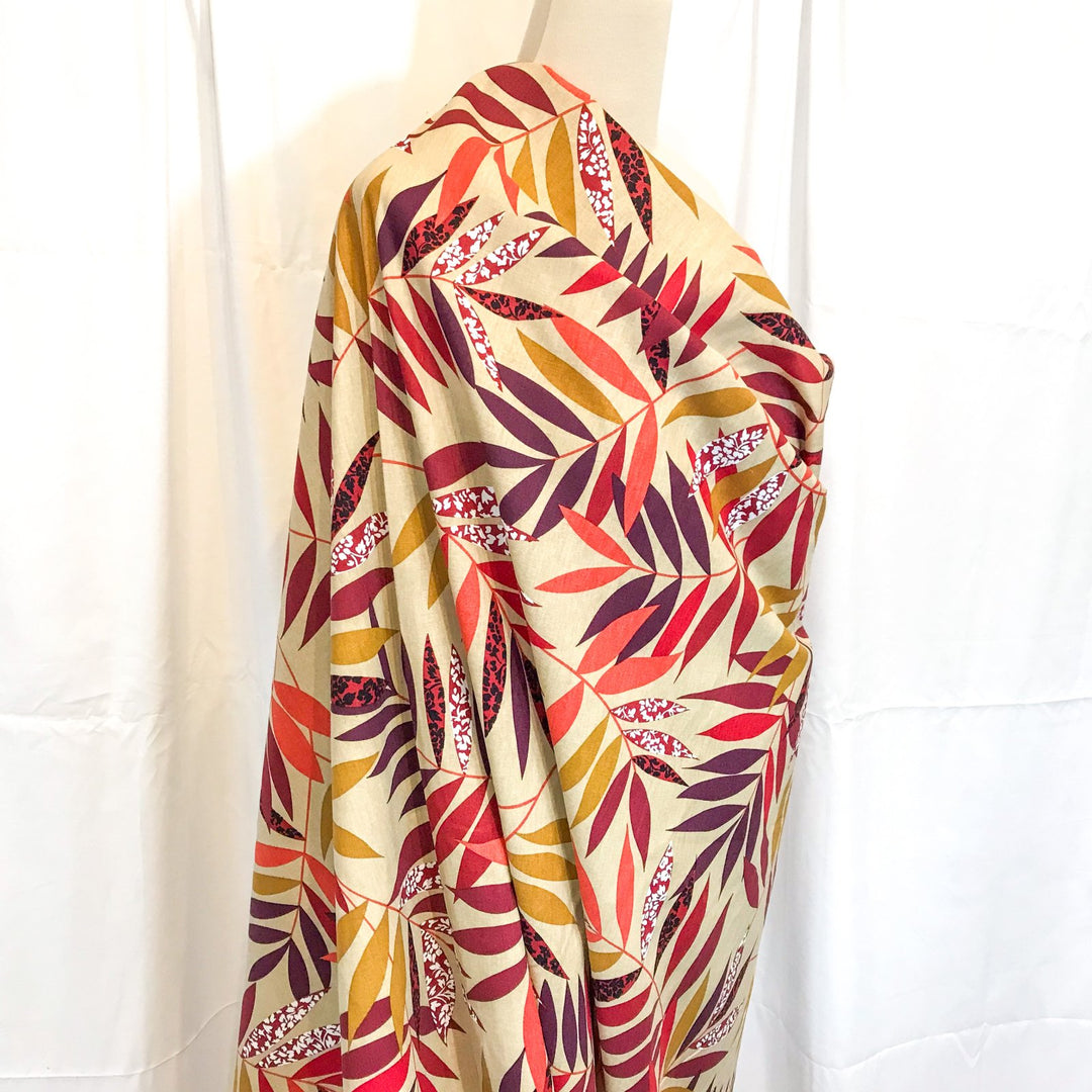 "Linen Red and Bordeaux Leaf – Soft linen fabric with autumn leaf print in burgundy, orange, maple, and purple tones"

