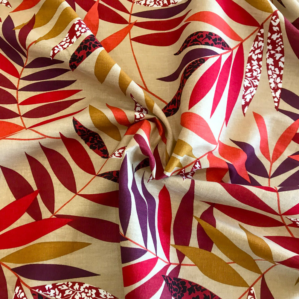 "Linen Red and Bordeaux Leaf – Soft linen fabric with autumn leaf print in burgundy, orange, maple, and purple tones"


