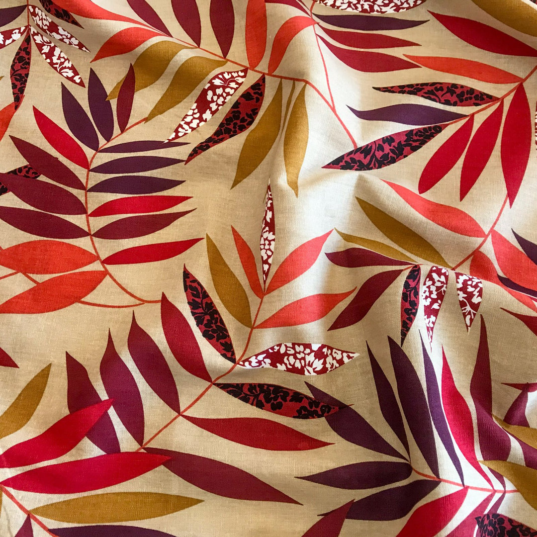 "Linen Red and Bordeaux Leaf – Soft linen fabric with autumn leaf print in burgundy, orange, maple, and purple tones"


