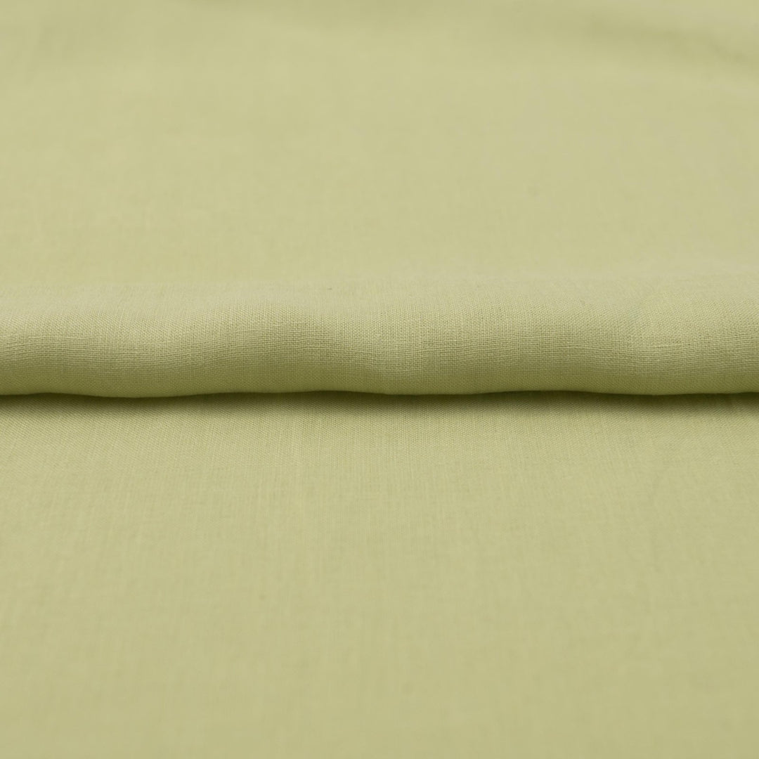 Lightweight linen fabric in soft celadon for sewing projects