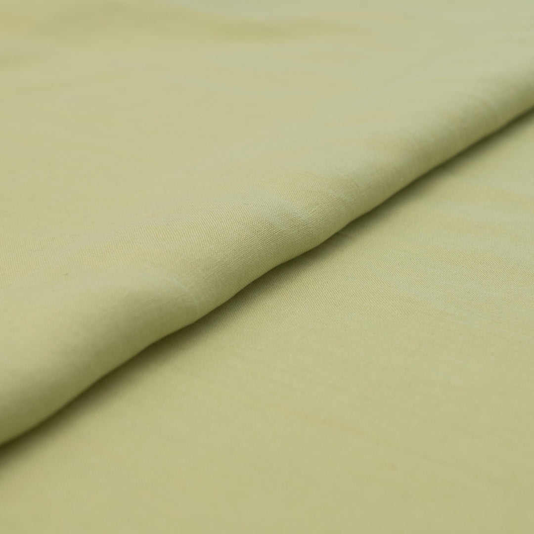 Lightweight linen fabric in soft celadon for sewing projects