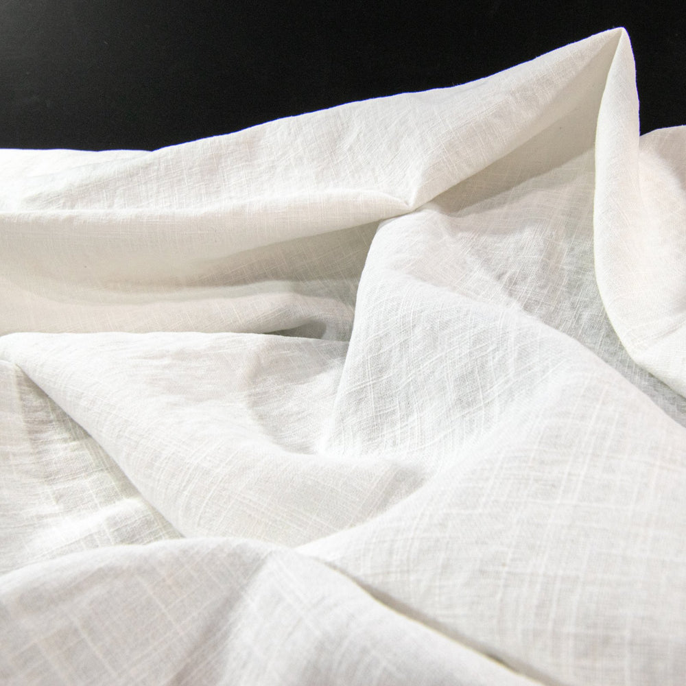 "Linen Cotton Blend Arctic White – Mid-weight opaque fabric, 55% linen and 45% cotton, ideal for blazers, pants, and dresses"

