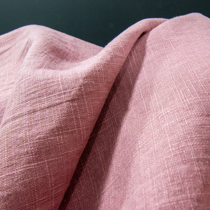 Soft Linen Cotton Blend fabric in Dusty Pink, showcasing a gentle texture and subtle woven pattern, perfect for creating stylish garments