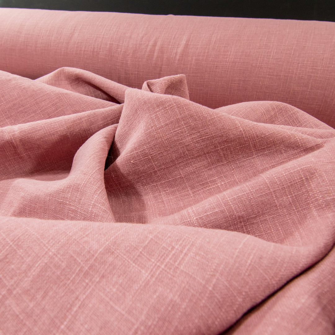 Soft Linen Cotton Blend fabric in Dusty Pink, showcasing a gentle texture and subtle woven pattern, perfect for creating stylish garments