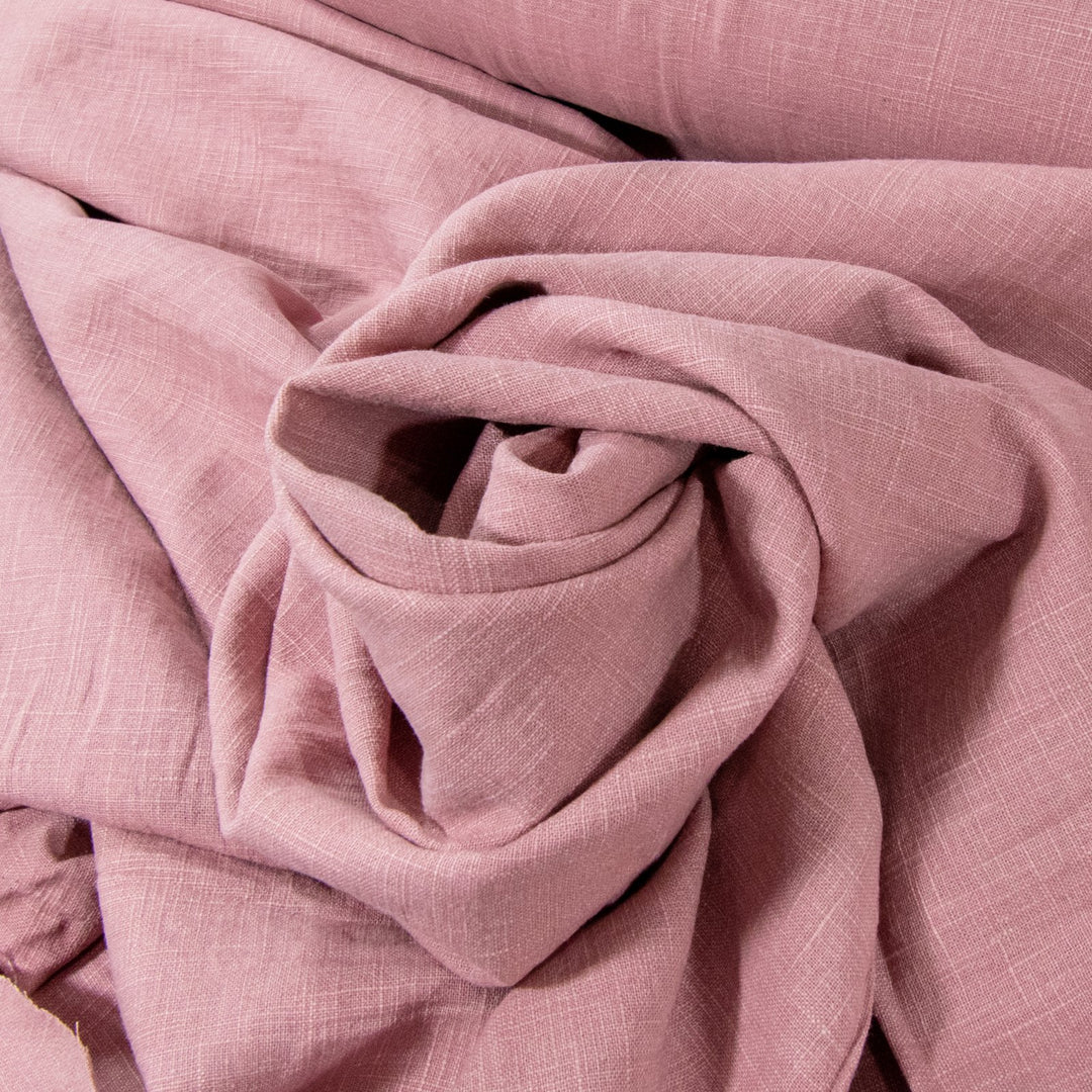 Soft Linen Cotton Blend fabric in Dusty Pink, showcasing a gentle texture and subtle woven pattern, perfect for creating stylish garments