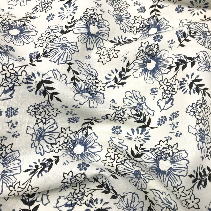"Cream linen fabric with blue and black floral print – lightweight, breathable, 100% linen for dresses, tops, and tunics."

