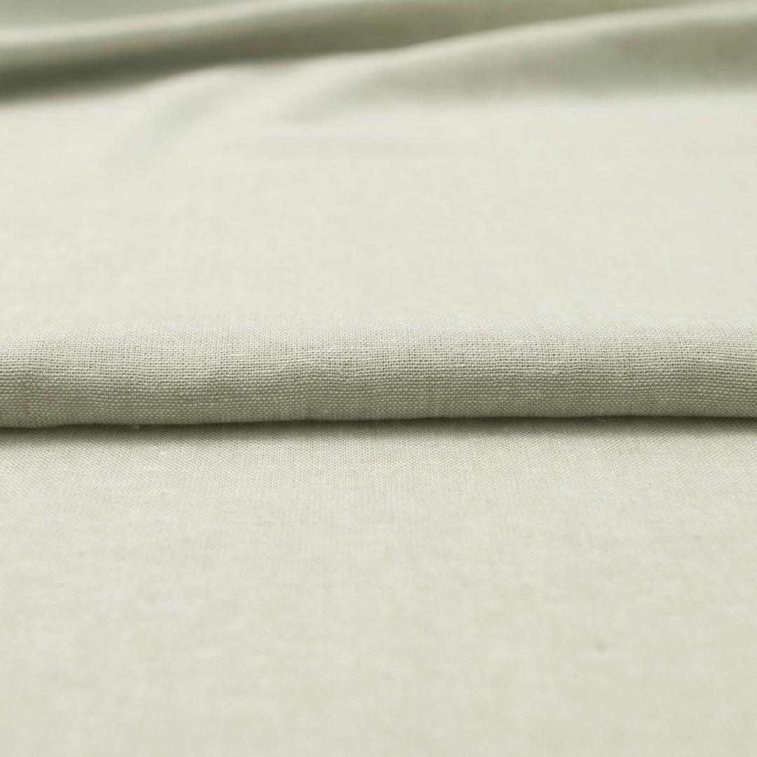 Close-up of Linen/Rayon Yarn Dye fabric in moss green showing yarn-dyed texture and color variation.
