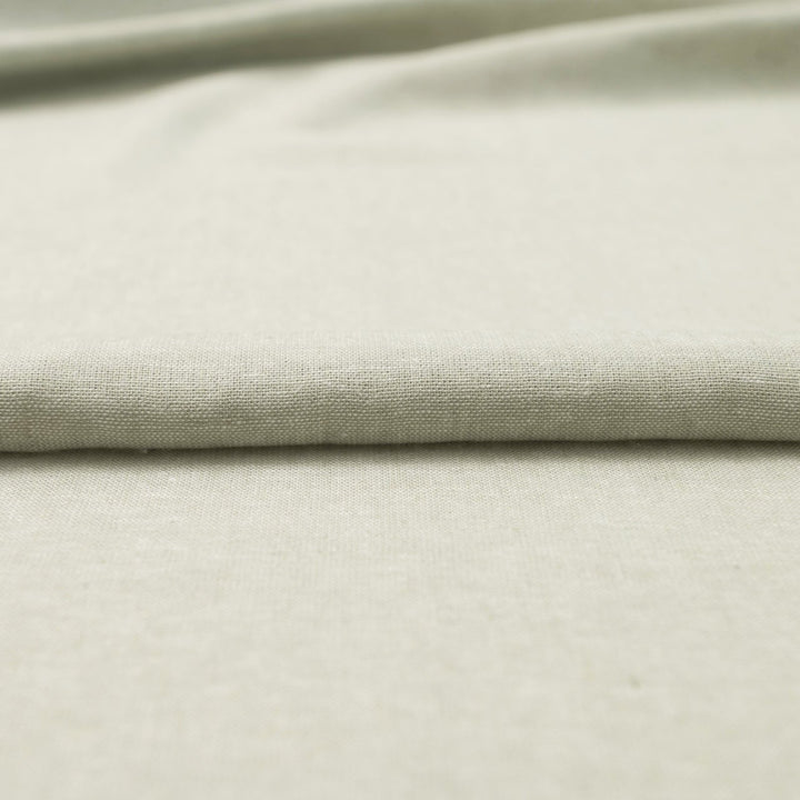 Close-up of Linen/Rayon Yarn Dye fabric in moss green showing yarn-dyed texture and color variation.