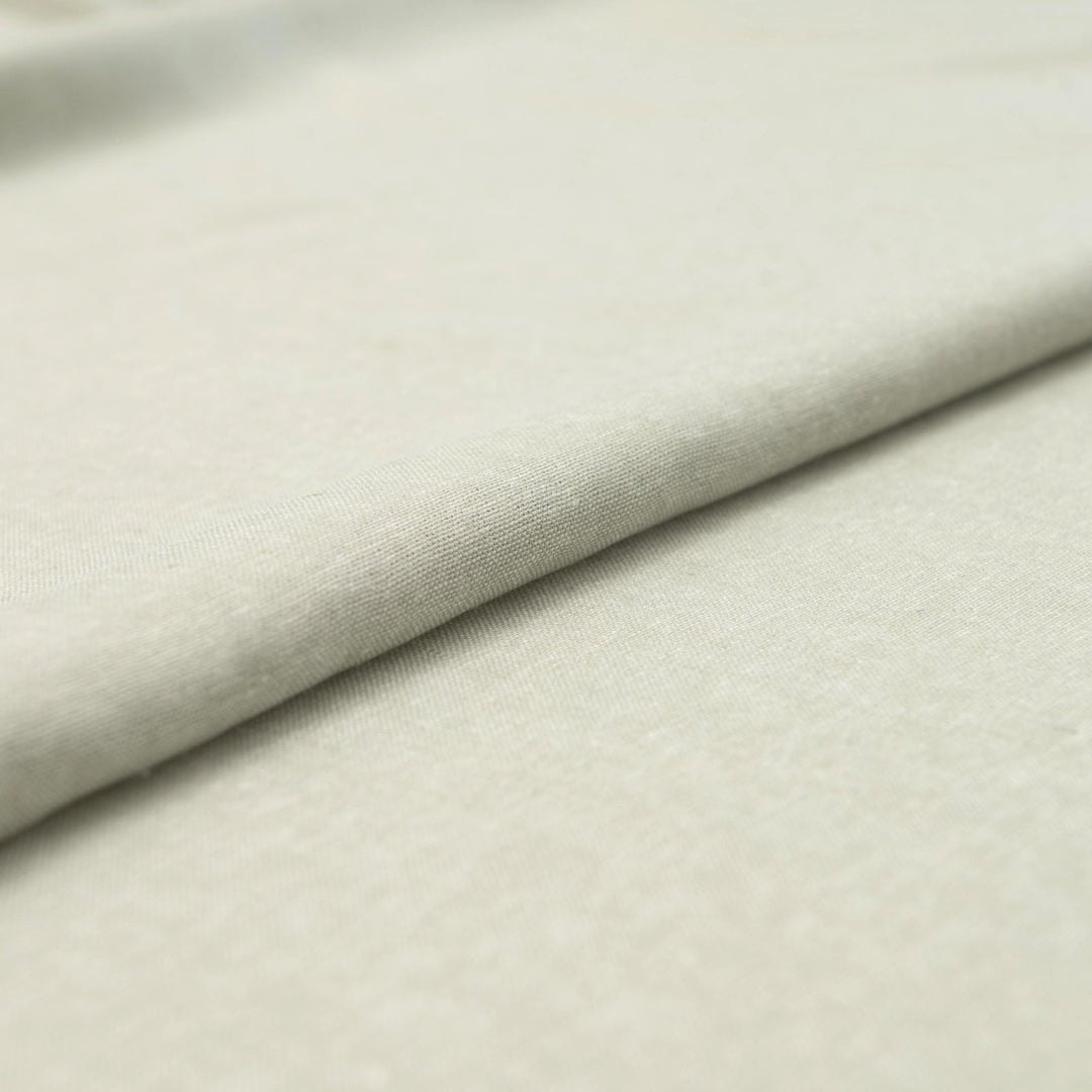 Close-up of Linen/Rayon Yarn Dye fabric in moss green showing yarn-dyed texture and color variation.
