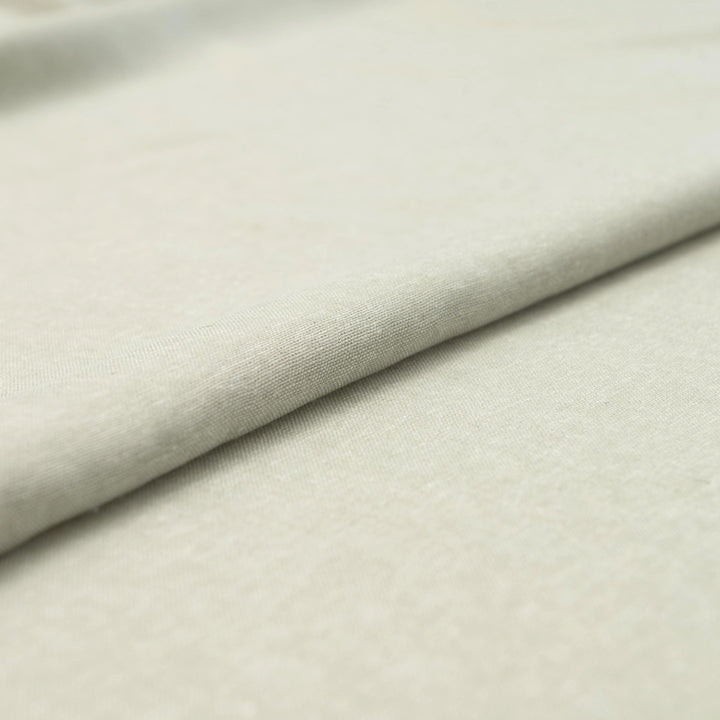Close-up of Linen/Rayon Yarn Dye fabric in moss green showing yarn-dyed texture and color variation.